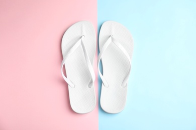 Photo of Flat lay composition with flip flops on color background. Beach objects