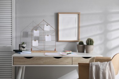 Memo board with notes on table in home office