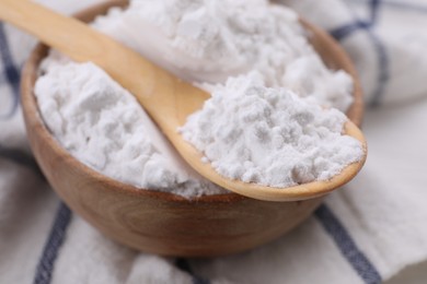 Bowl and spoon of starch, closeup view