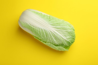 Fresh ripe Chinese cabbage on yellow background, top view