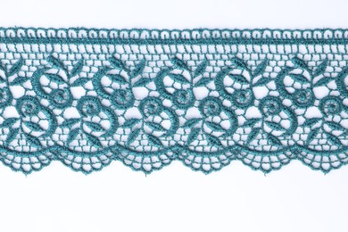 Photo of Beautiful lace on white background, top view