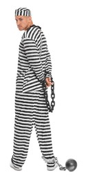 Photo of Prisoner in striped uniform with chained hands and metal ball on white background