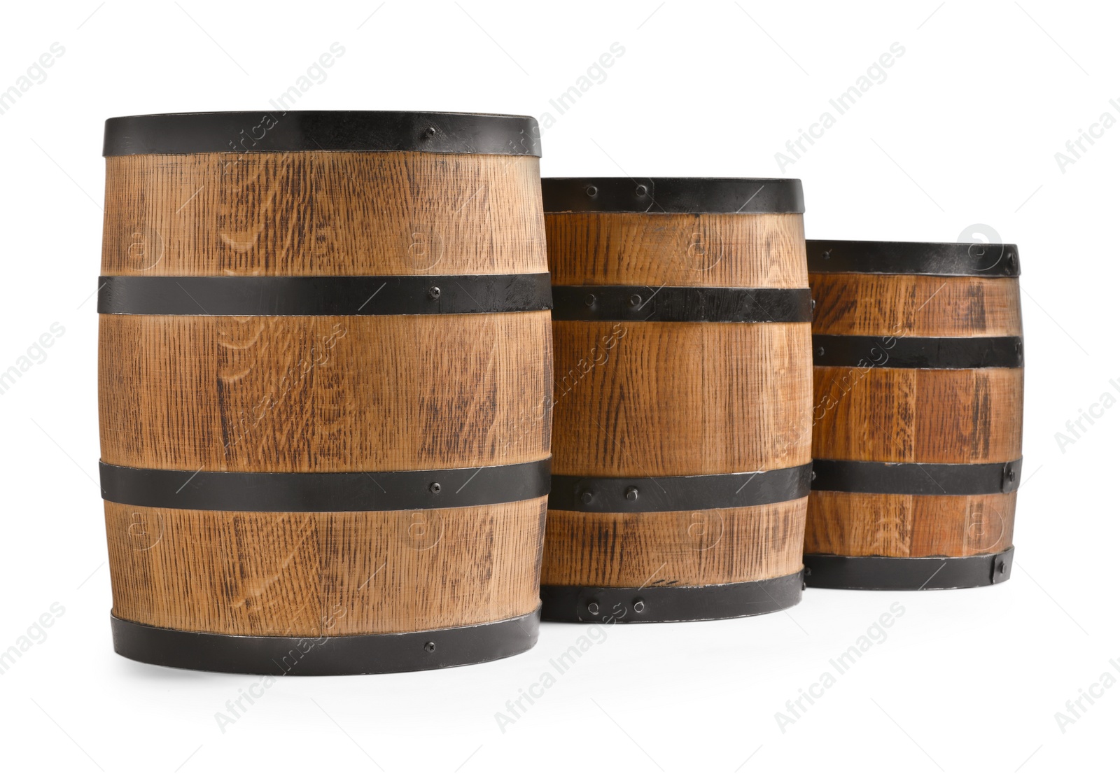 Photo of Three traditional wooden barrels on white background