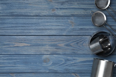 Photo of Set of modern cooking utensils on blue wooden table, flat lay. Space for text