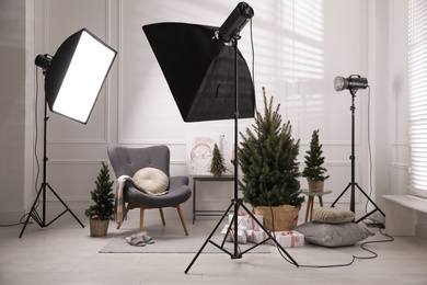 Photo of Beautiful Christmas themed photo zone. Cozy living room interior imitation