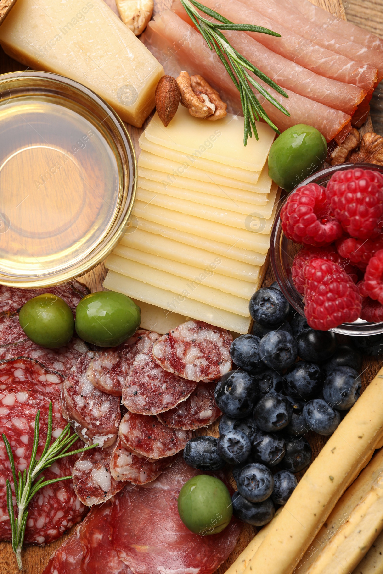 Photo of Snack set with delicious Parmesan cheese on plate, top view