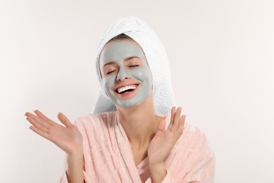 Photo of Woman with face mask on white background, space for text. Spa treatments