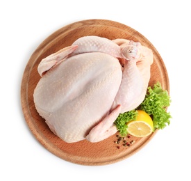 Wooden board with raw turkey and ingredients on white background, top view