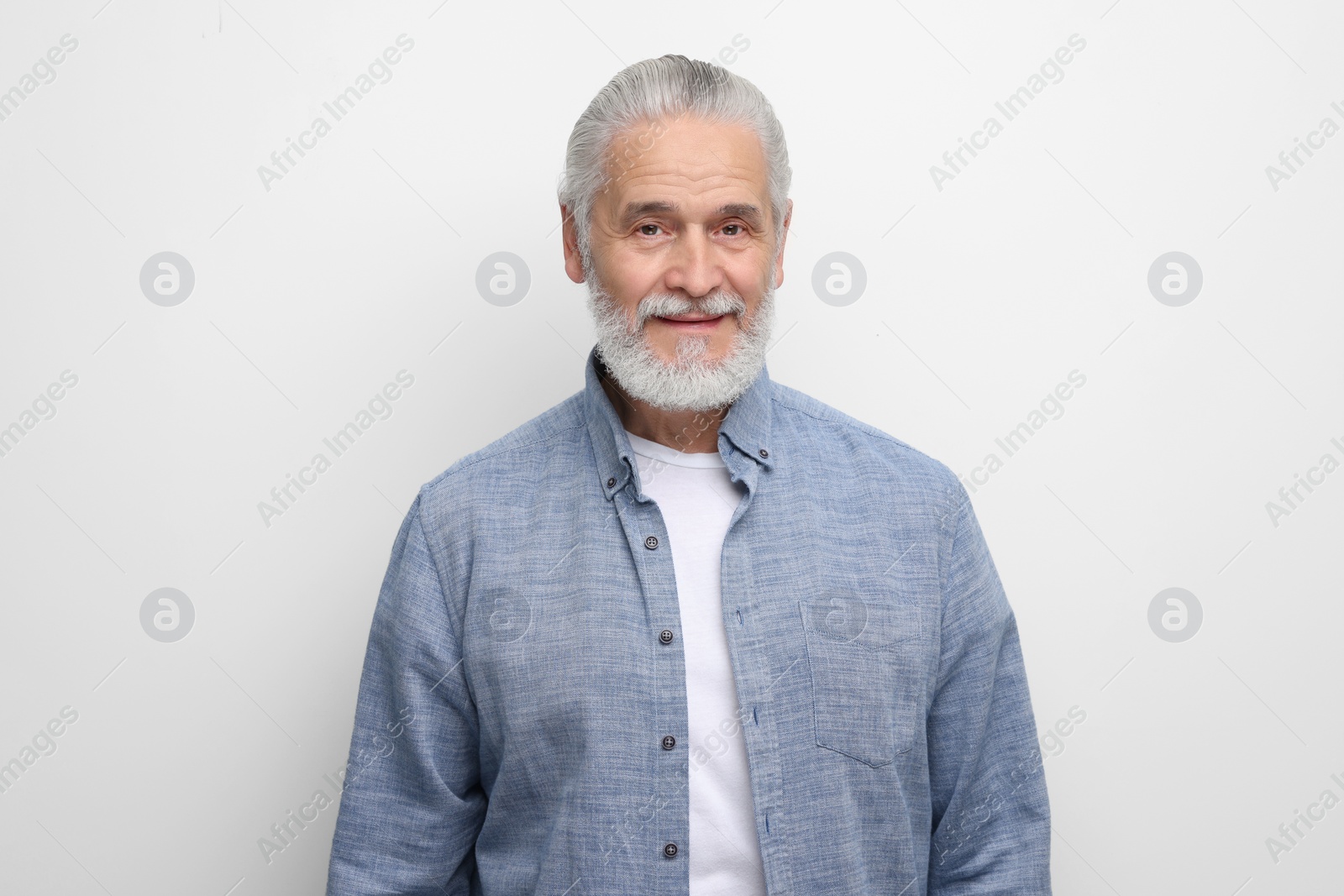 Photo of Portrait of handsome senior man on white background