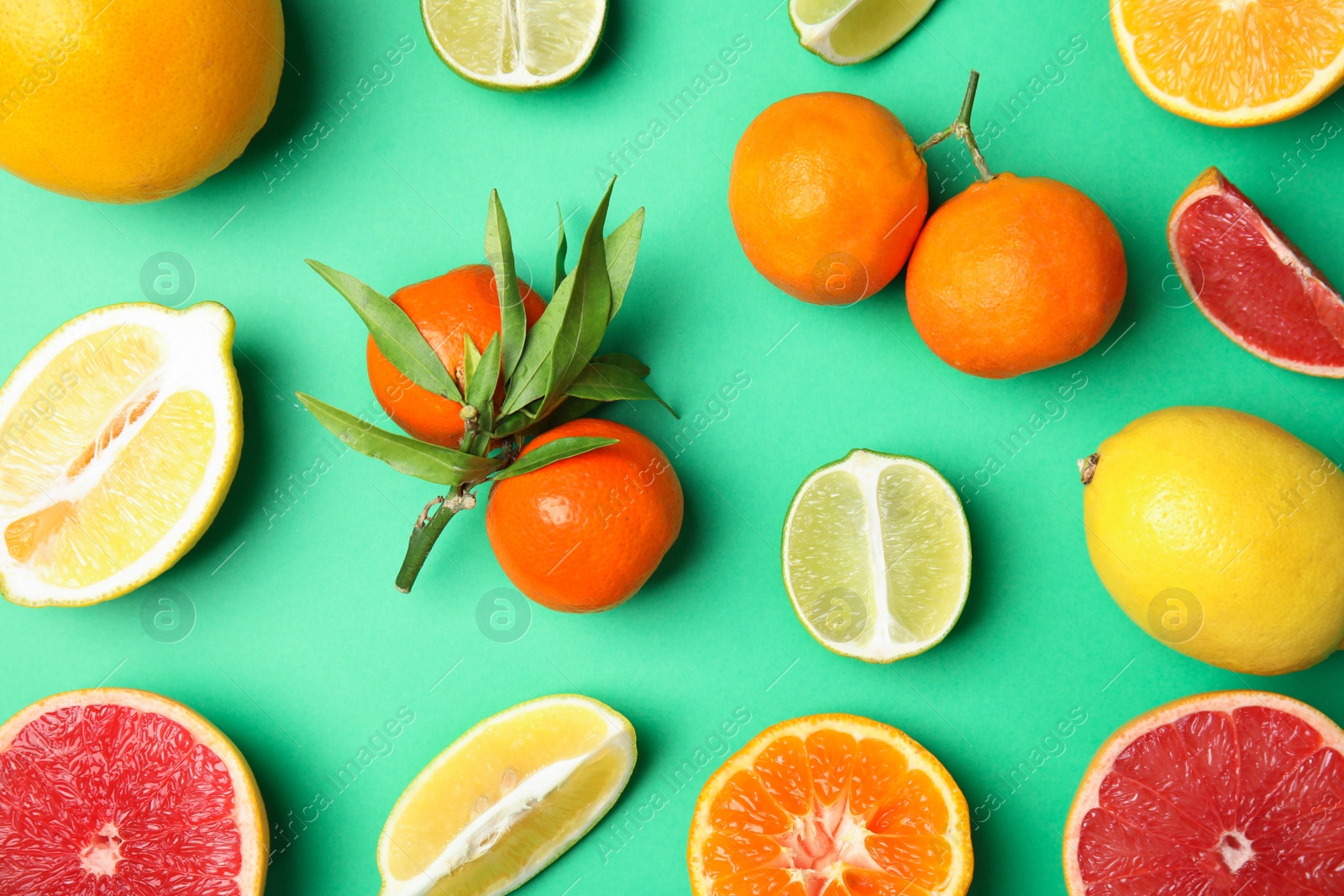 Photo of Different citrus fruits on color background, flat lay