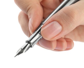 Photo of Woman holding stylish fountain pen on white background, closeup