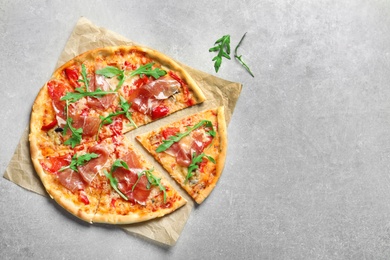 Photo of Delicious pizza with meat on light background, top view