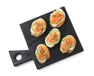 Photo of Tasty canapes with salmon, cucumber and cream cheese isolated on white, top view