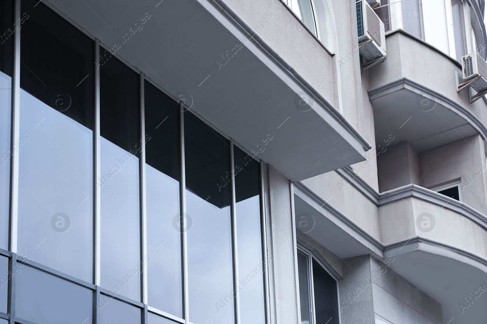 Photo of Modern office building with tinted windows. Urban architecture