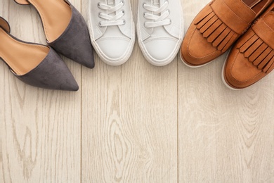 Photo of Different female shoes on floor