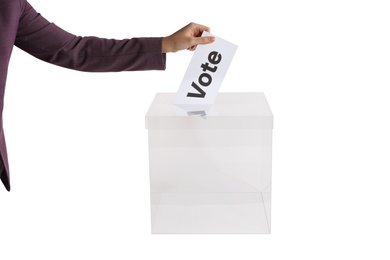 Woman putting her vote into ballot box on white background, closeup