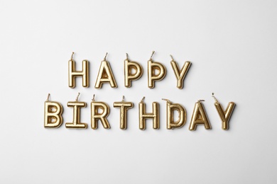 Photo of Flat lay composition with birthday candles on light background