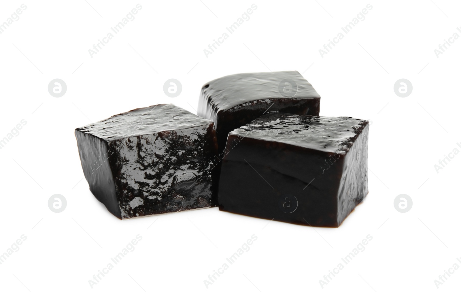 Photo of Delicious grass jelly cubes on white background