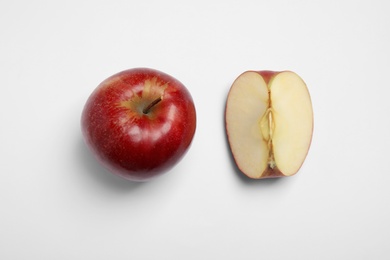 Photo of Ripe juicy red apples on white background, top view