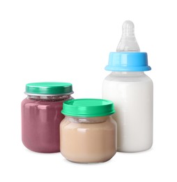 Healthy baby food and bottle with milk on light grey background