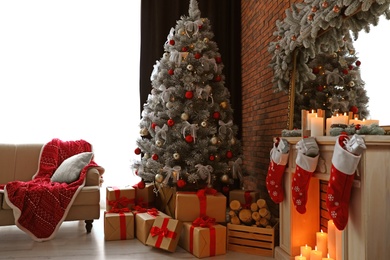 Photo of Stylish room interior with beautiful Christmas tree