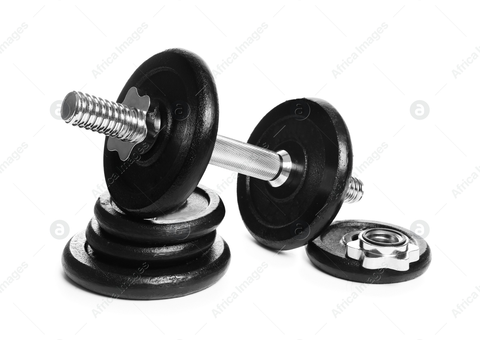 Photo of Professional dumbbell and weight plates on white background. Sporting equipment