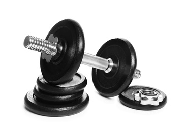 Photo of Professional dumbbell and weight plates on white background. Sporting equipment