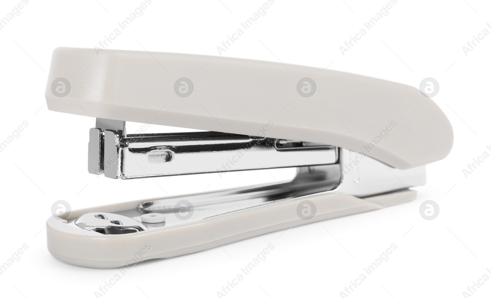 Photo of One new beige stapler isolated on white