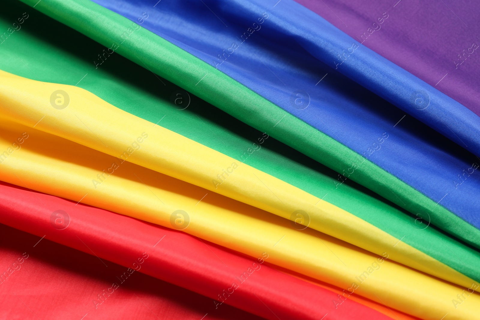 Photo of Rainbow LGBT flag as background, closeup view