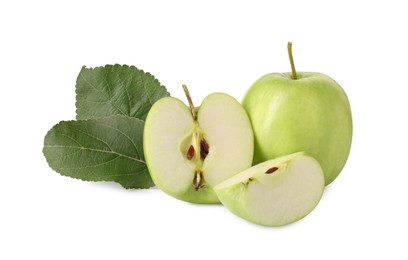 Photo of Whole, cut green apples and leaves isolated on white