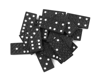 Pile of black domino tiles on white background, top view