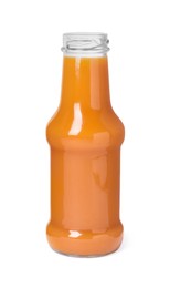 Photo of Fresh carrot juice in glass bottle isolated on white