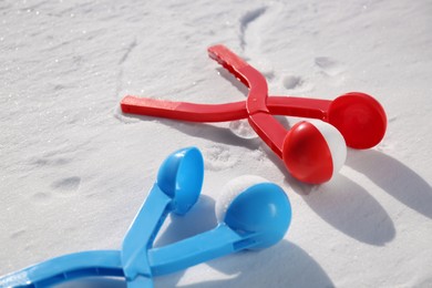 Photo of Snowballs and plastic tools outdoors on winter day
