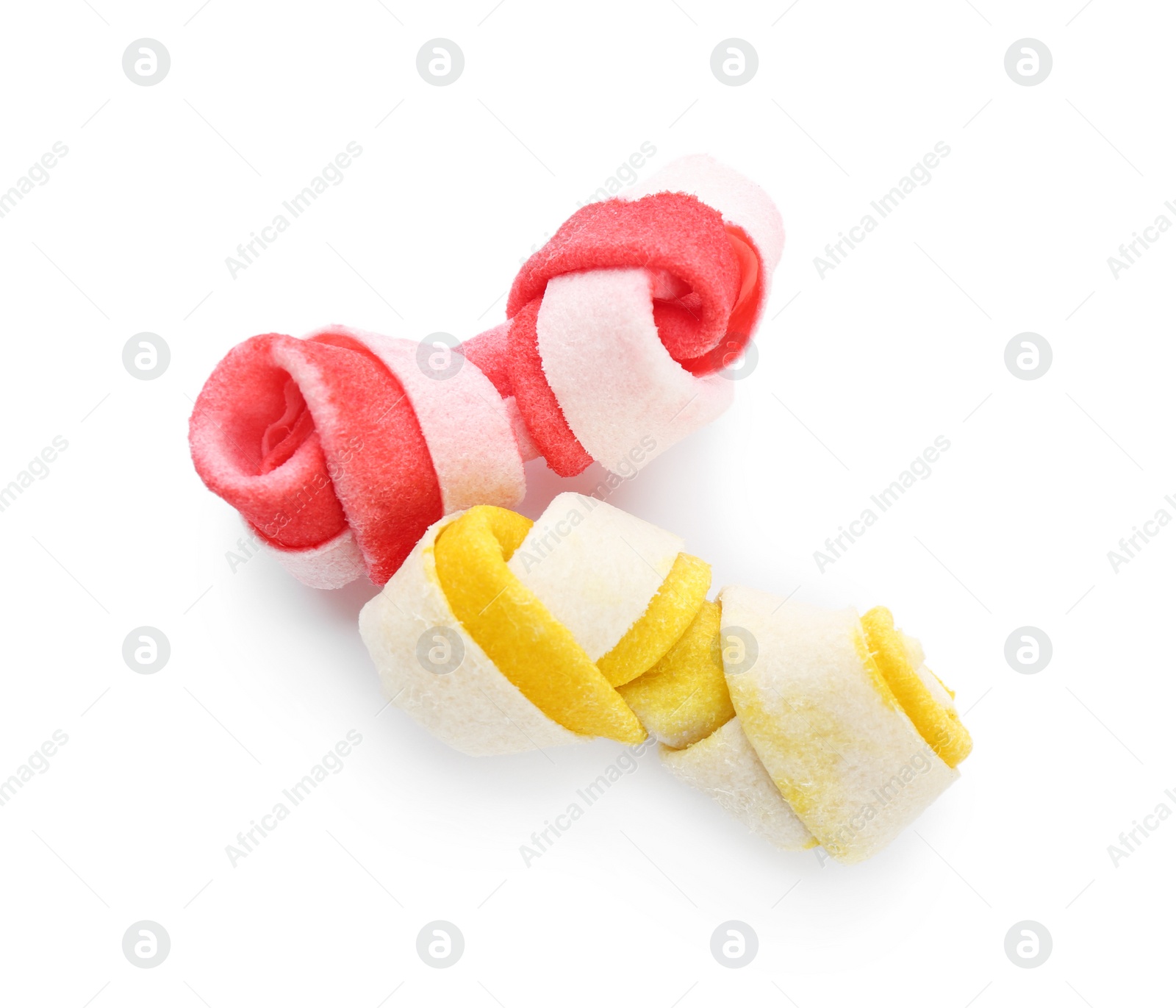 Photo of Chew bones for dog on white background, top view. Pet toys