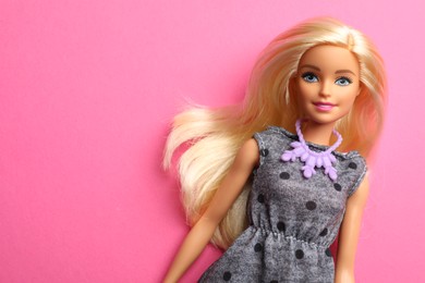 Mykolaiv, Ukraine - September 4, 2023: Beautiful Barbie doll on pink background, space for text