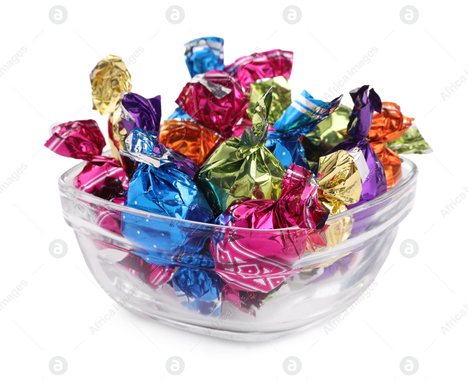 Photo of Bowl with candies in colorful wrappers isolated on white