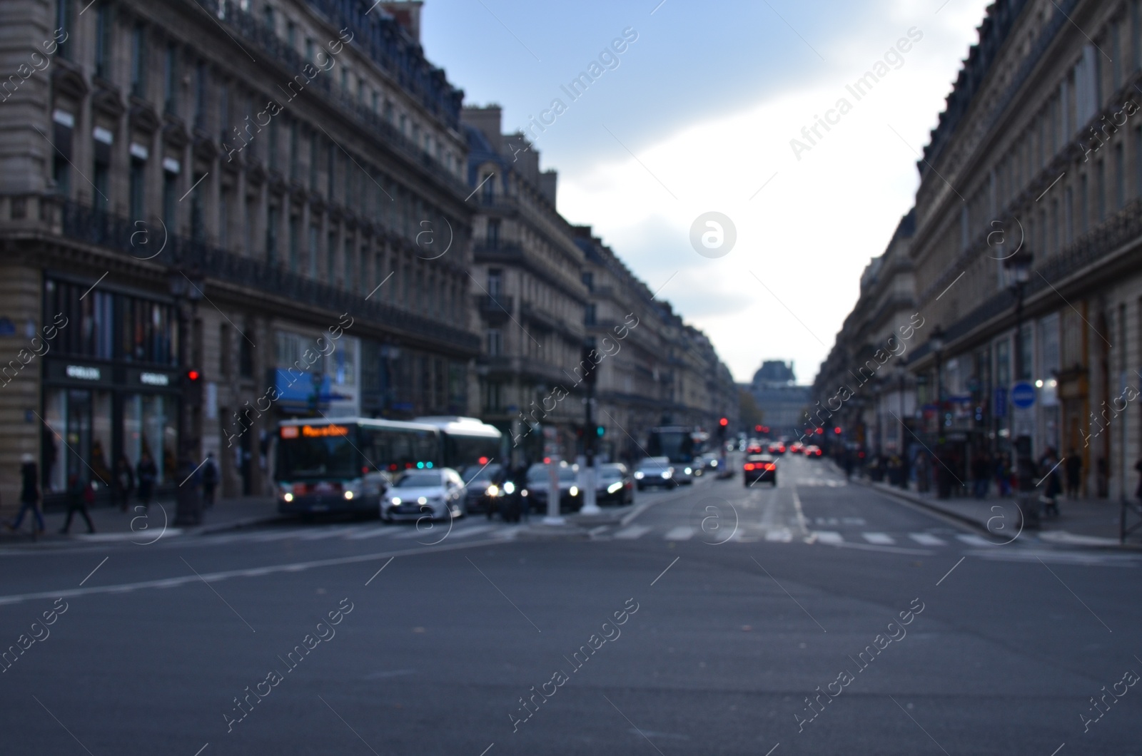 Photo of Blurred view of street with beautiful buildings and cars