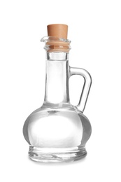Photo of Glass jug with vinegar on white background