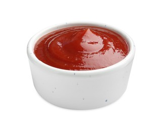 Tasty ketchup in bowl isolated on white. Tomato sauce