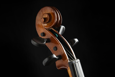 Photo of Beautiful violin on black background, closeup view