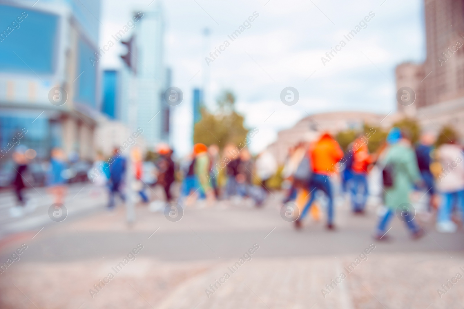 Photo of People walking on city street, blurred view