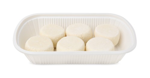 Photo of Container with uncooked cottage cheese pancakes isolated on white