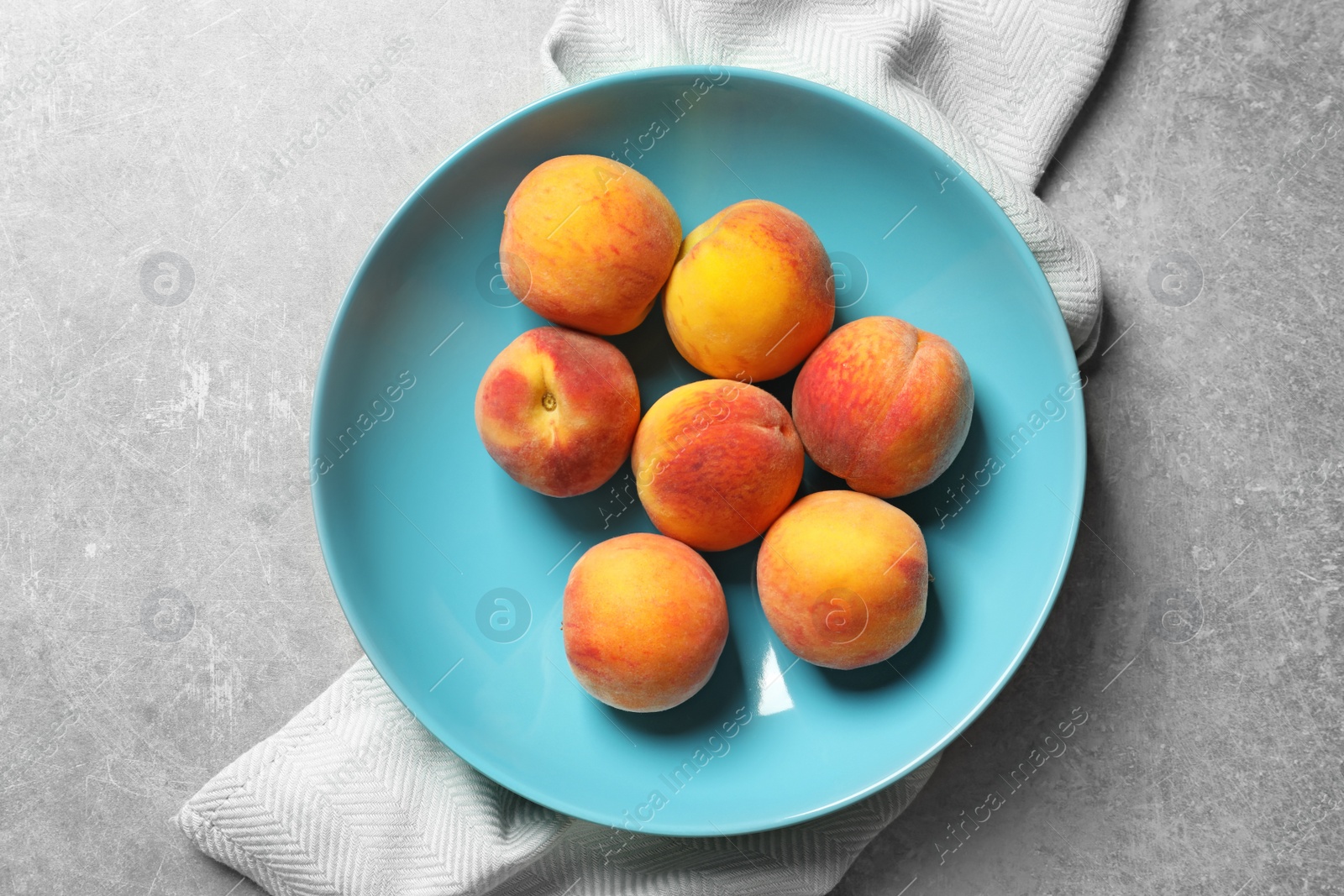 Photo of Plate with fresh sweet peaches on table, top view