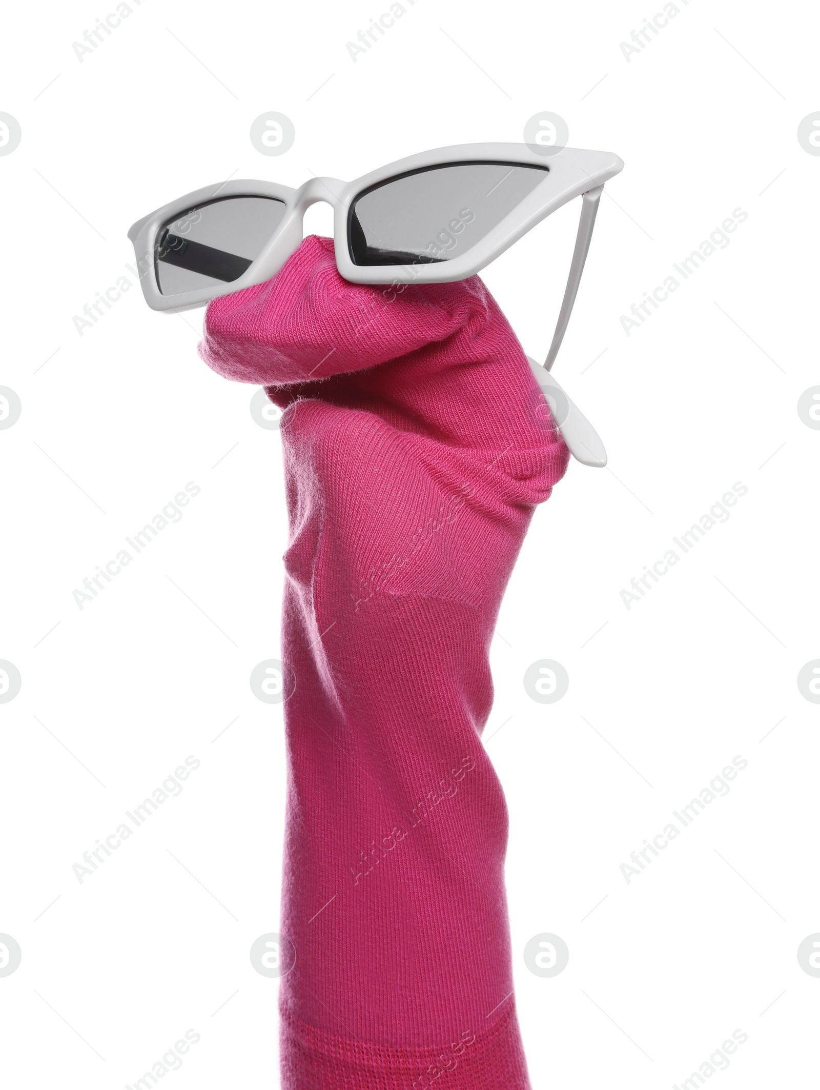 Photo of Funny sock puppet with sunglasses isolated on white