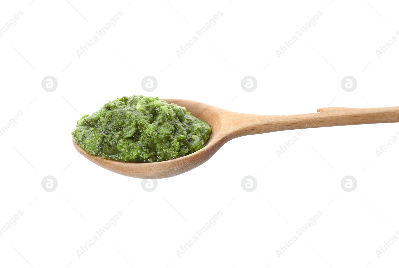 Photo of Spoon of tasty pesto sauce isolated on white