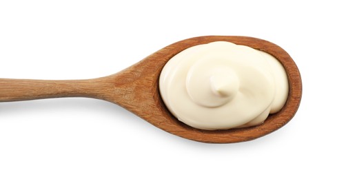 Photo of Natural yogurt in wooden spoon isolated on white, top view