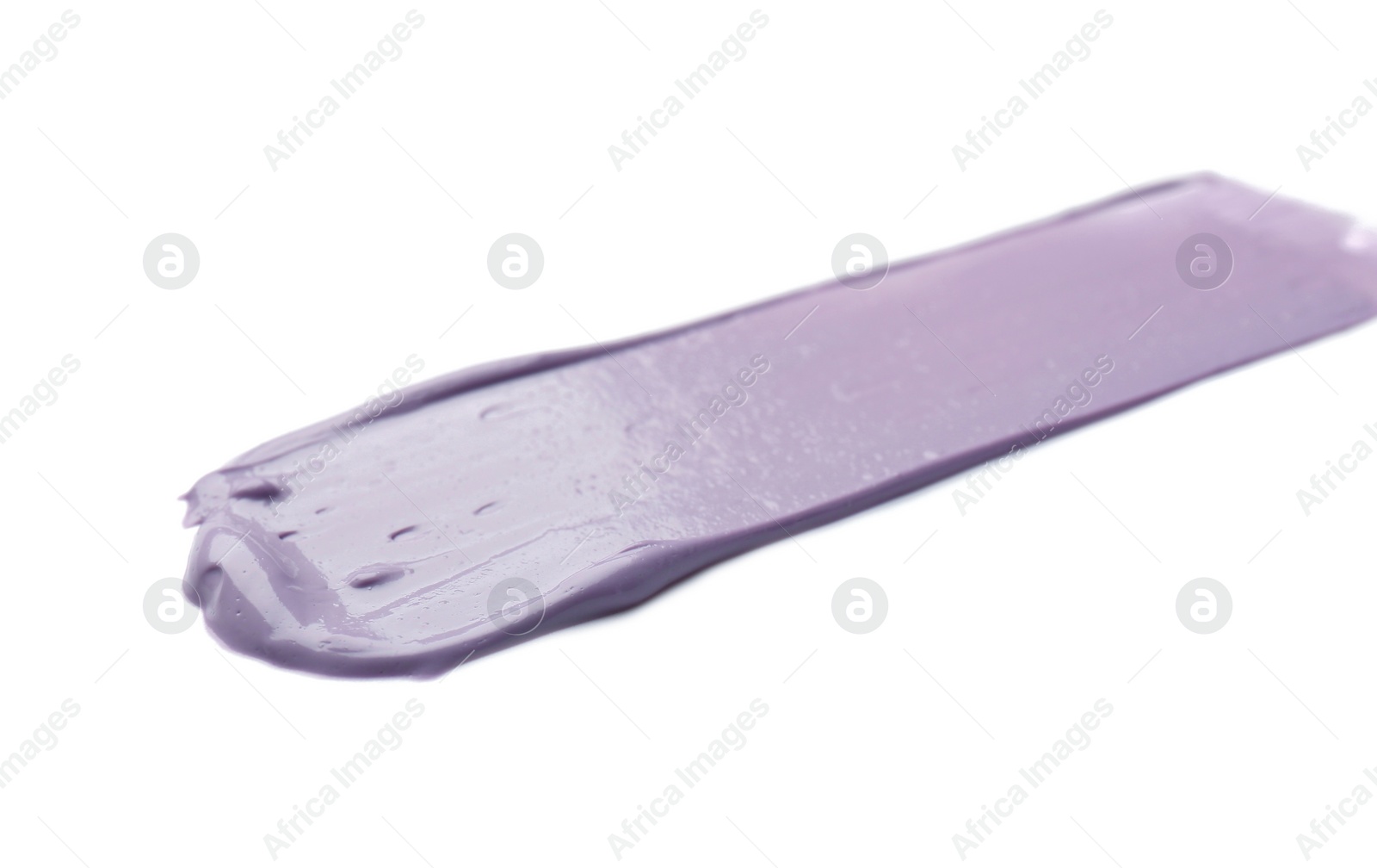 Photo of Stroke of purple correcting concealer on white background