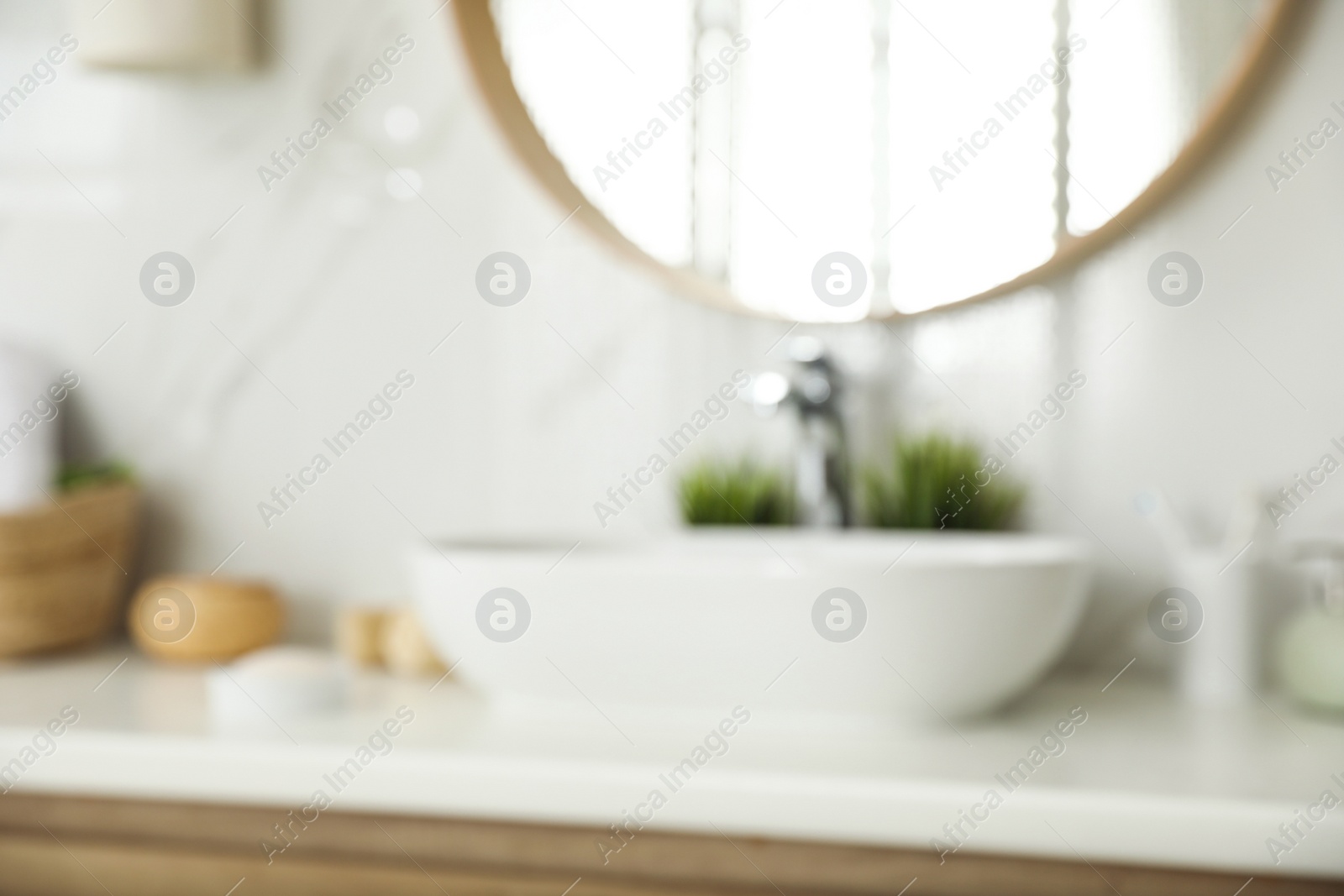 Photo of Blurred view of stylish modern bathroom with mirror