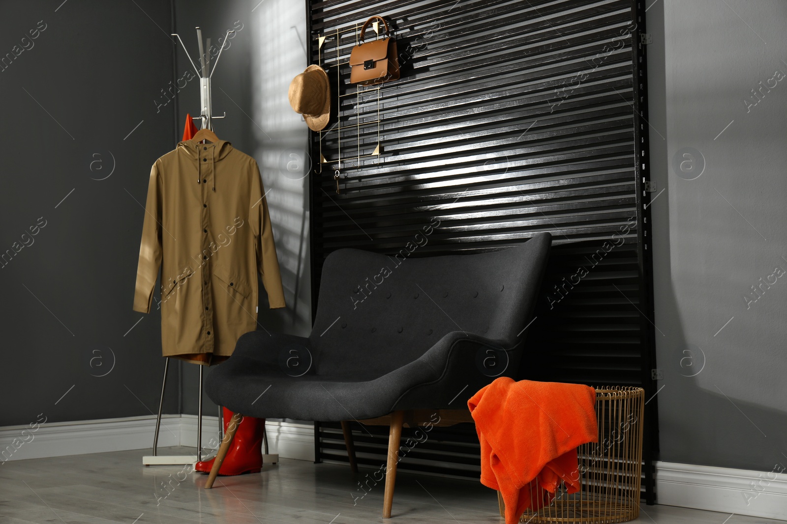 Photo of Hallway interior with sofa, clothes and accessories