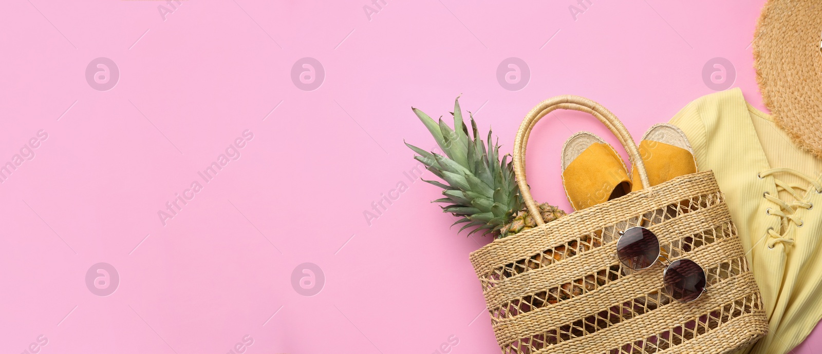 Photo of Flat lay composition with woman's straw bag on pink background